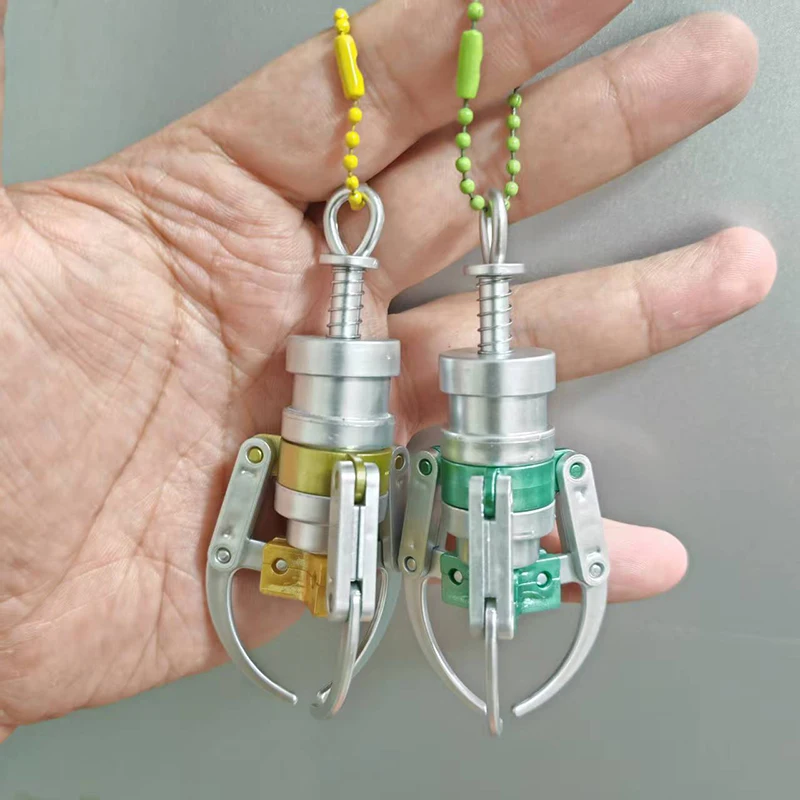 NEW Creative Press Type Catch Dolls Claw Model Keychain Mini Simulation Claw Machine Decompression Keychain Backpack Pendant
