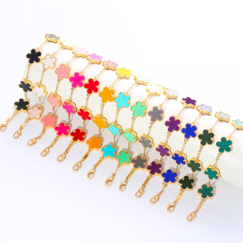 A delicate resin bracelet with floral-shaped decorative inlays, featuring a simple design style.
