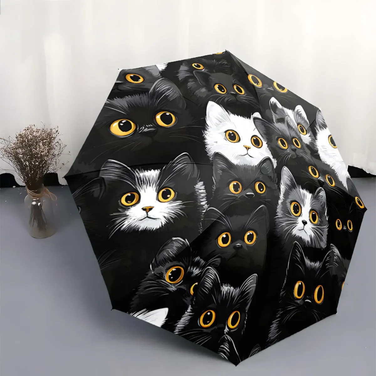 

Folding Umbrella The umbrella features patterns of black and white cats with large yellow eyes. Core characters: Black Cat, Wh