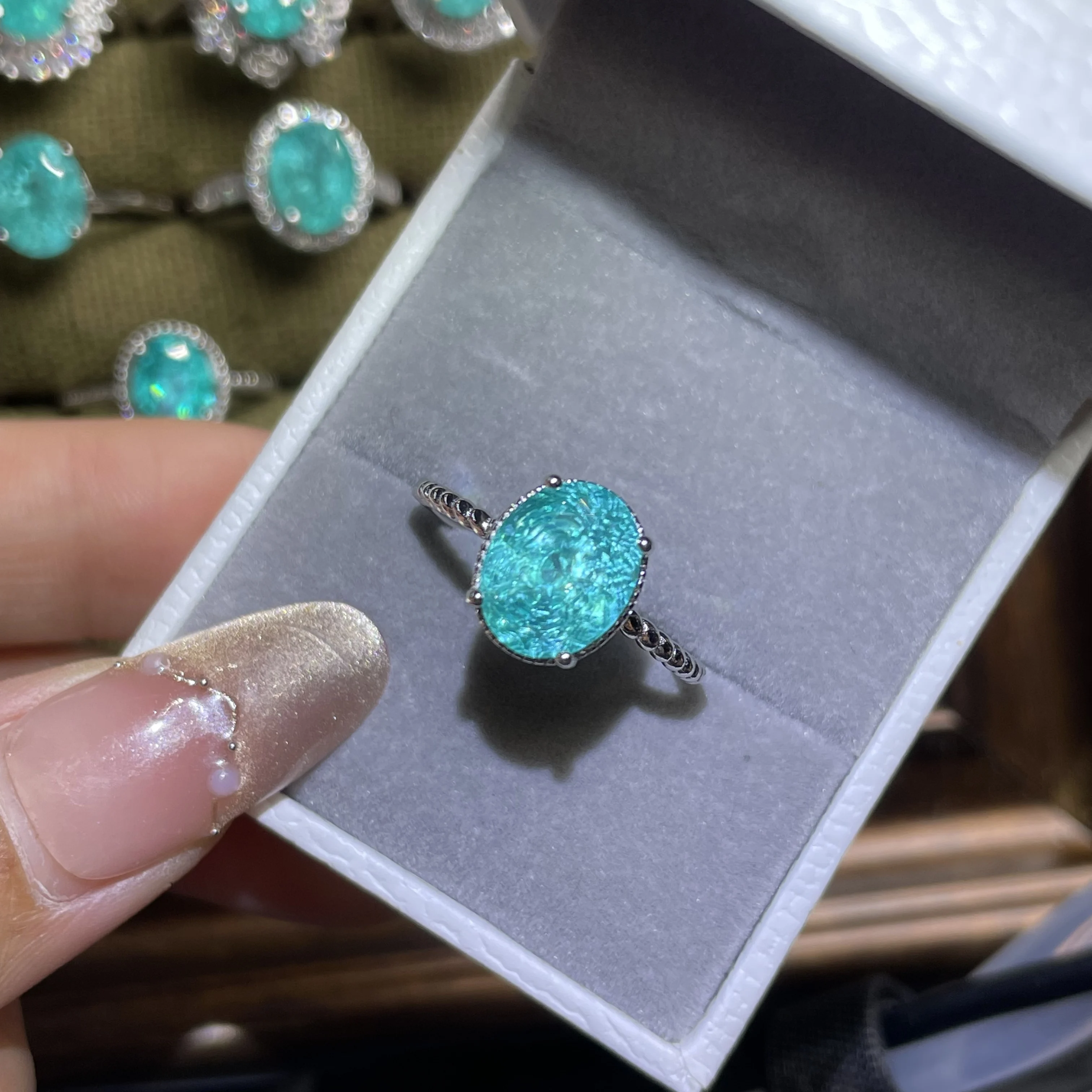 

6CT 925 sterling silver Paraiba tourmaline ring. The neon blue color is simply amazing. It's a favorite among young pe