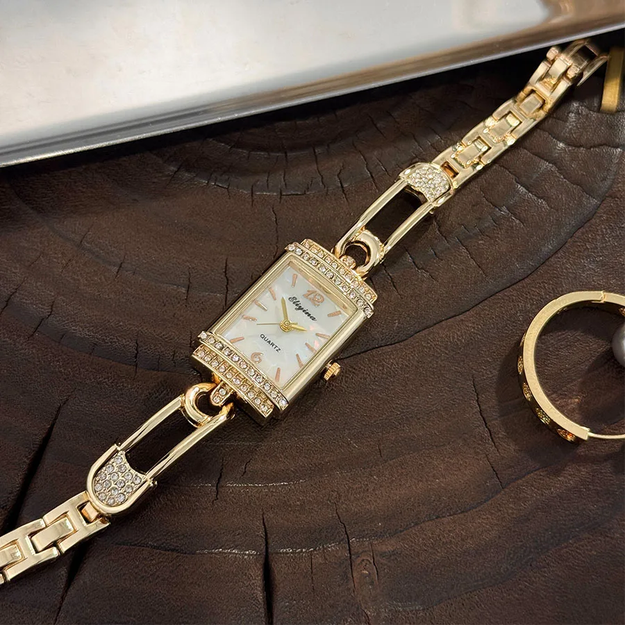موضة جديدة دبوس كوارتز ساعة نسائية فاخرة الحد الأدنى الراقية جولة قوس الزجاج الماس مرصع مربع ساعة اليد