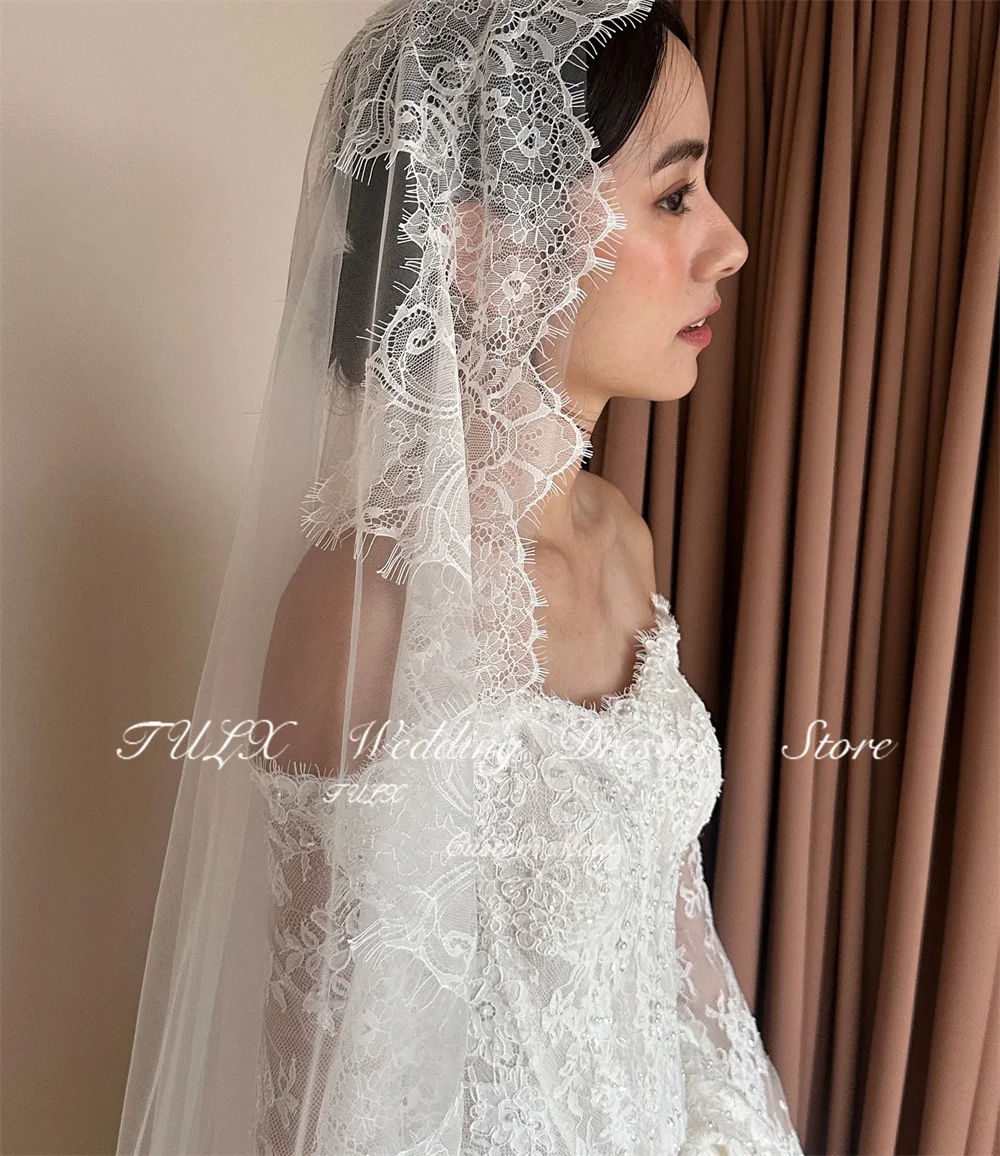 ชุดแต่งงานลูกไม้สีงาช้างหรูหรา TULX สไตล์เกาหลี ถ่ายรูป ชุดเจ้าสาวแขนยาวเปิดไหล่ คอร์เซ็ทสั่งตัดได้ 웨딩드레스