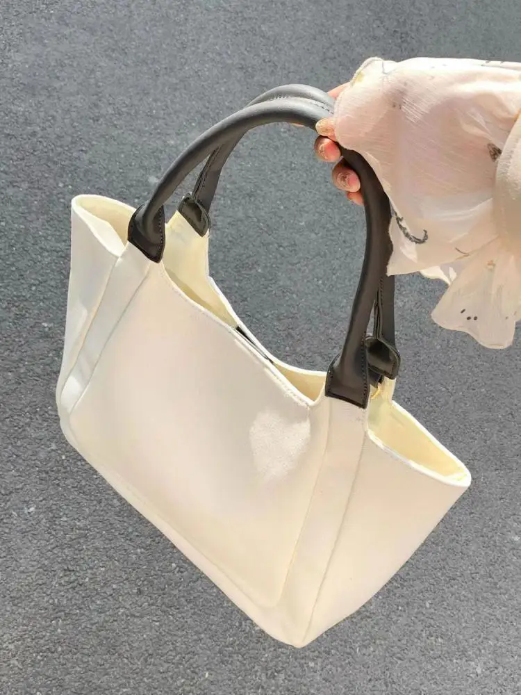 Korean version casual splicing canvas large capacity bag 2023 new minimalist and versatile commuting portable shoulder bag