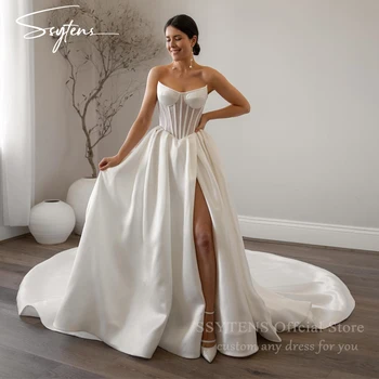 セクシーな白いウェディングドレス,カスタマイズされたボーンコルセット,自由奔放に生きるスタイル,プリンセスドレス,ハイスリット,パーティードレス