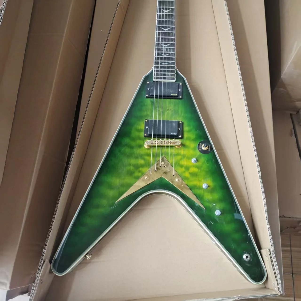 

Customized V-shaped electric guitar with peach blossom core wood and QMT veneer, active pickup. Free Shipping