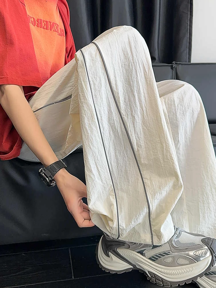 

Новинка 2025 года, мужские повседневные брюки из ледяного шелка, тонкие прямые свободные летние спортивные длинные брюки Qui Dry, модный американский бренд, свободная посадка