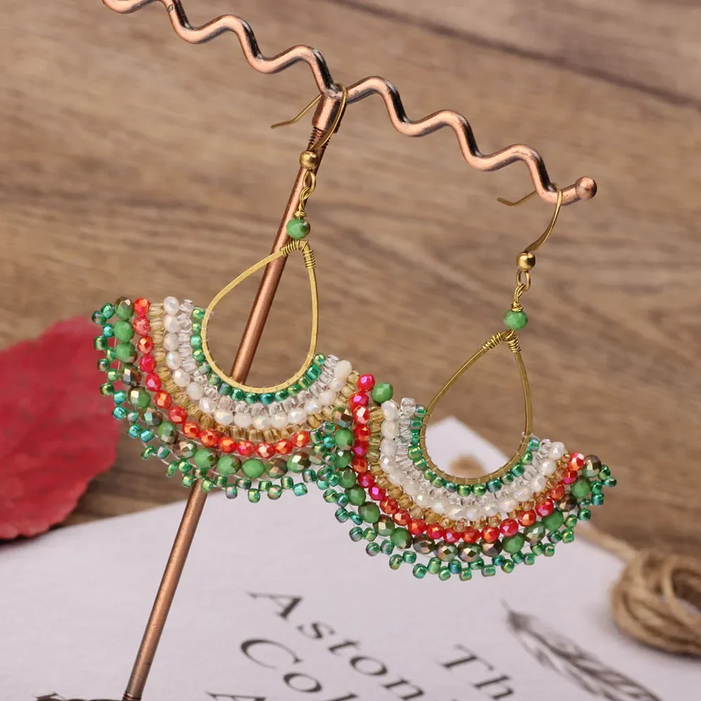 

Rice bead earrings Water drop Hand weaving Bohemia Fan Alloy Originality Nationality Fashion Simplicity Beaded earrings