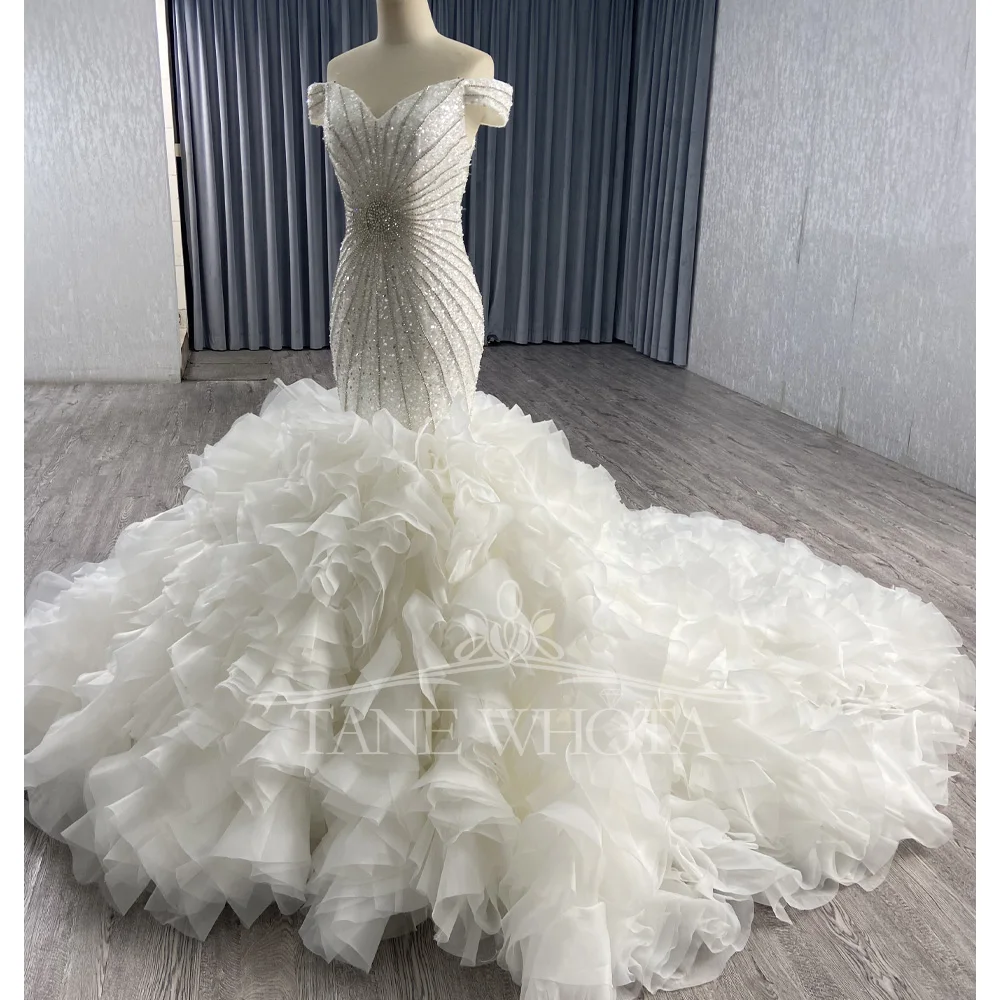 ชุดแต่งงานแบบไม่มีแขน ดีไซน์เซ็กซี่หวานซึ้ง ประดับด้วยลูกปัดและเลื่อม แต่งเชือกผูกด้านหลัง ทรงเข้ารูป สามารถสั่งตัดได้ สวยสง่างาม ทันสมัย