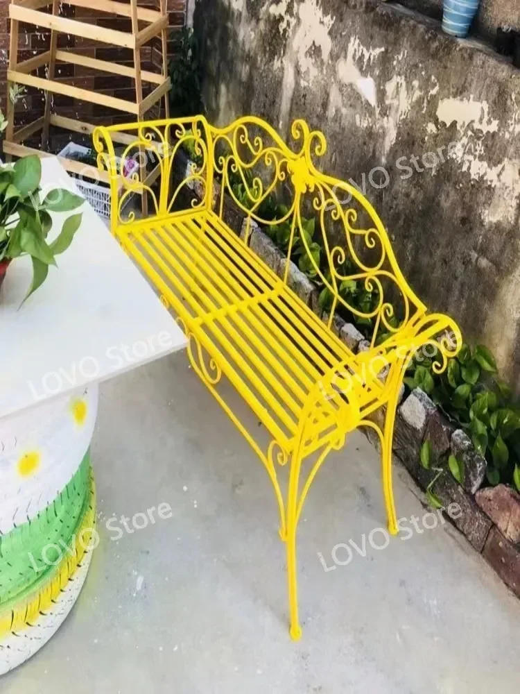 Outdoor garden bench  wrought iron table and chairs  balcony Courtyard