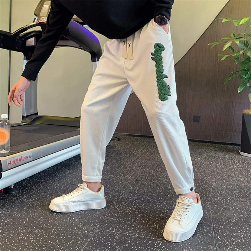 

Модные повседневные брюки с надписями для мужчин, весенне-осенние, стильные, облегающие, спортивные, свободного кроя, длиной 7/8