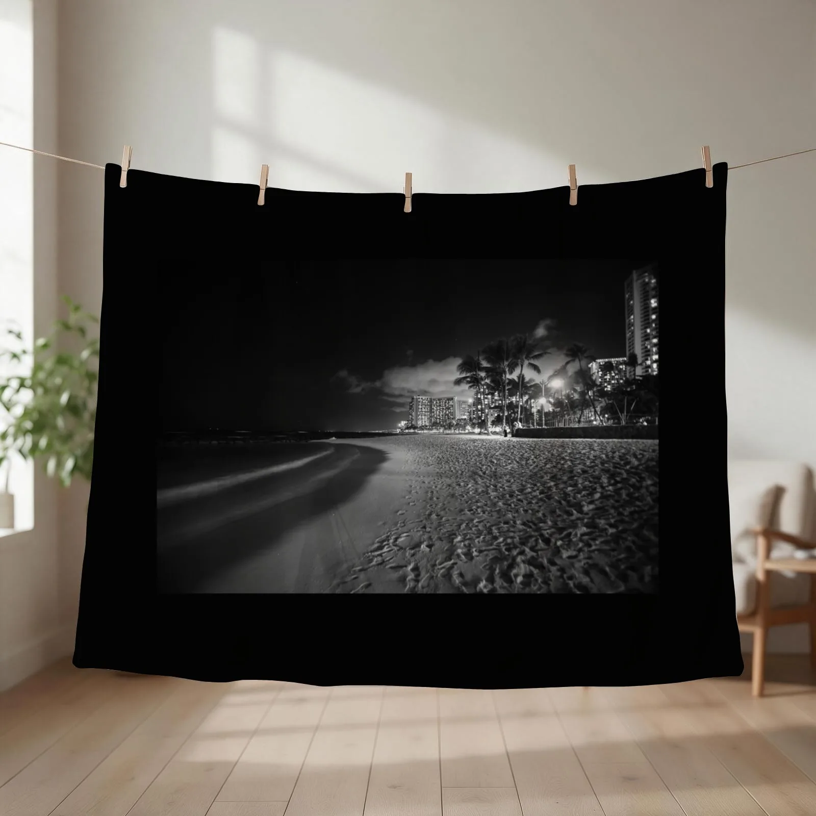 New Beach palm trees and buildings of Waikiki from beach on tropical island night Throw Blanket