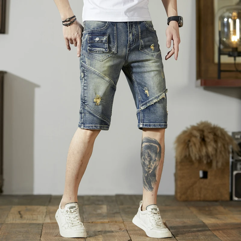 Pantaloncini di jeans retrò da uomo con cuciture strappate personalità del motociclo di moda pantaloni corti elasticizzati Slim di tipo coreano retrò