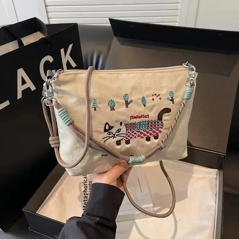 bolsa-de-ombro-bordada-de-personalidade-de-nylon-padrao-de-gato-bolsas-femininas-de-alta-qualidade-a-venda-2025-novas-bolsas-crossbody-casuais-requintadas