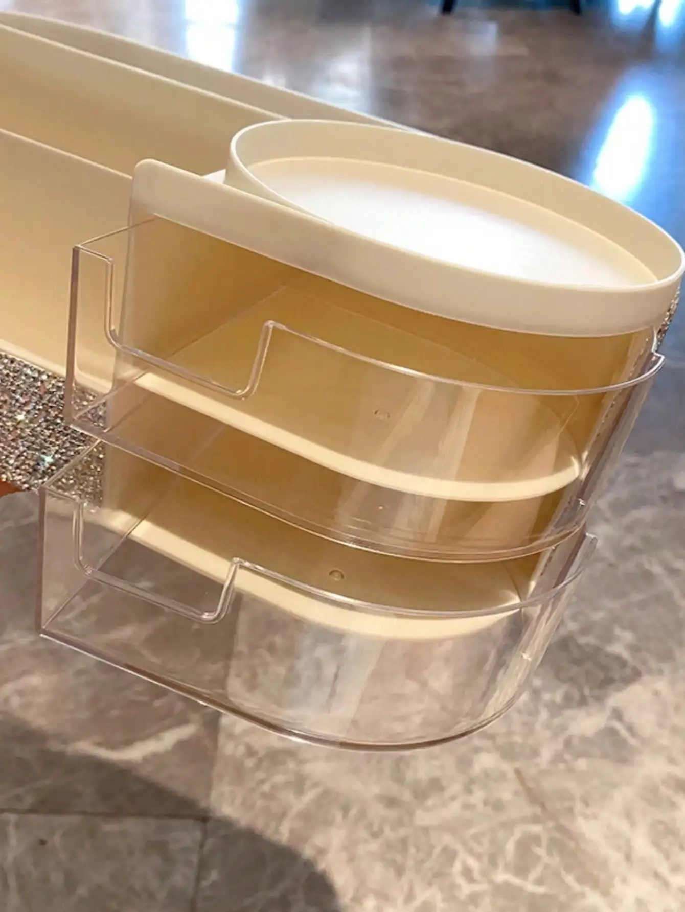 One artificial diamond-encrusted makeup brush and a drawer-style storage box for skin care products