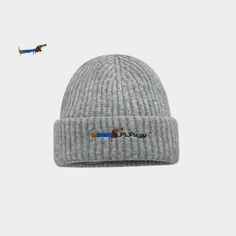 Gorro de lana cálido de punto bordado con cachorros ins auténticos para mujer, gorro fresco versátil para invierno con protección para los oídos para estudiantes