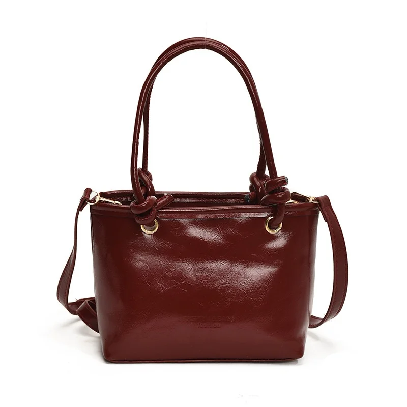 2025 nueva moda invierno versión coreana tendencia hermosa Color sólido Casual Simple bandolera bolso de cubo portátil mujeres