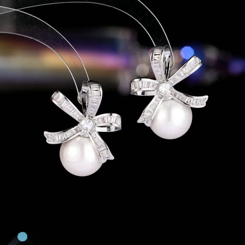 

S925 Silver Needle Elegant Temperament Wholesale Super Shiny Square Zircon Inlaid High-end Bowknot Pearl Stud Earrings