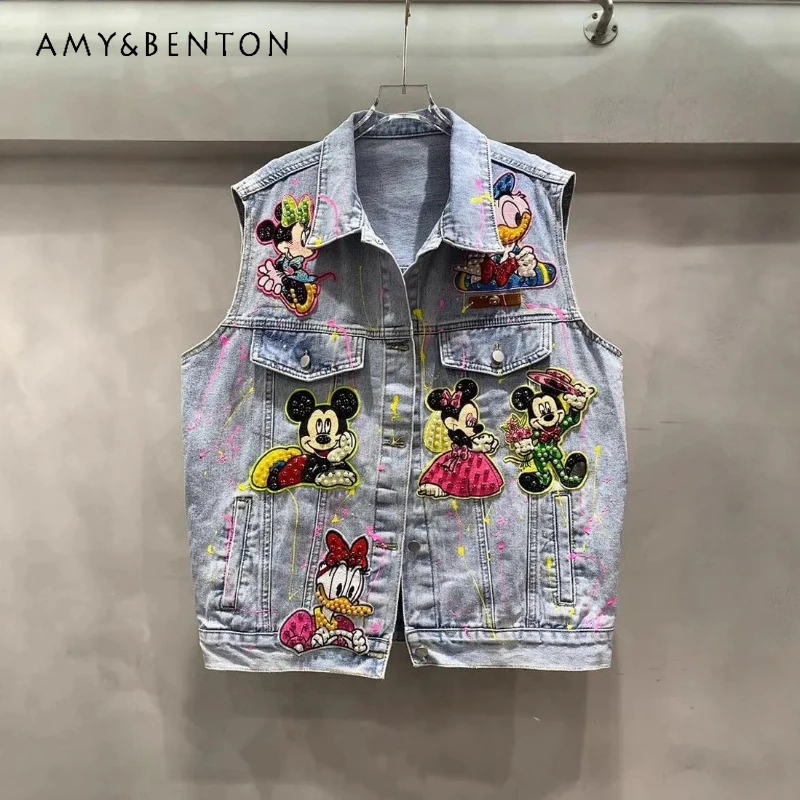 Kamizelka w stylu commuter z koralikami, cekinami i graffiti, kurtka dżinsowa o średniej długości w stylu heavy industry, wiosna-jesień 2026, kamizelka Y2k z motywem kreskówkowym.