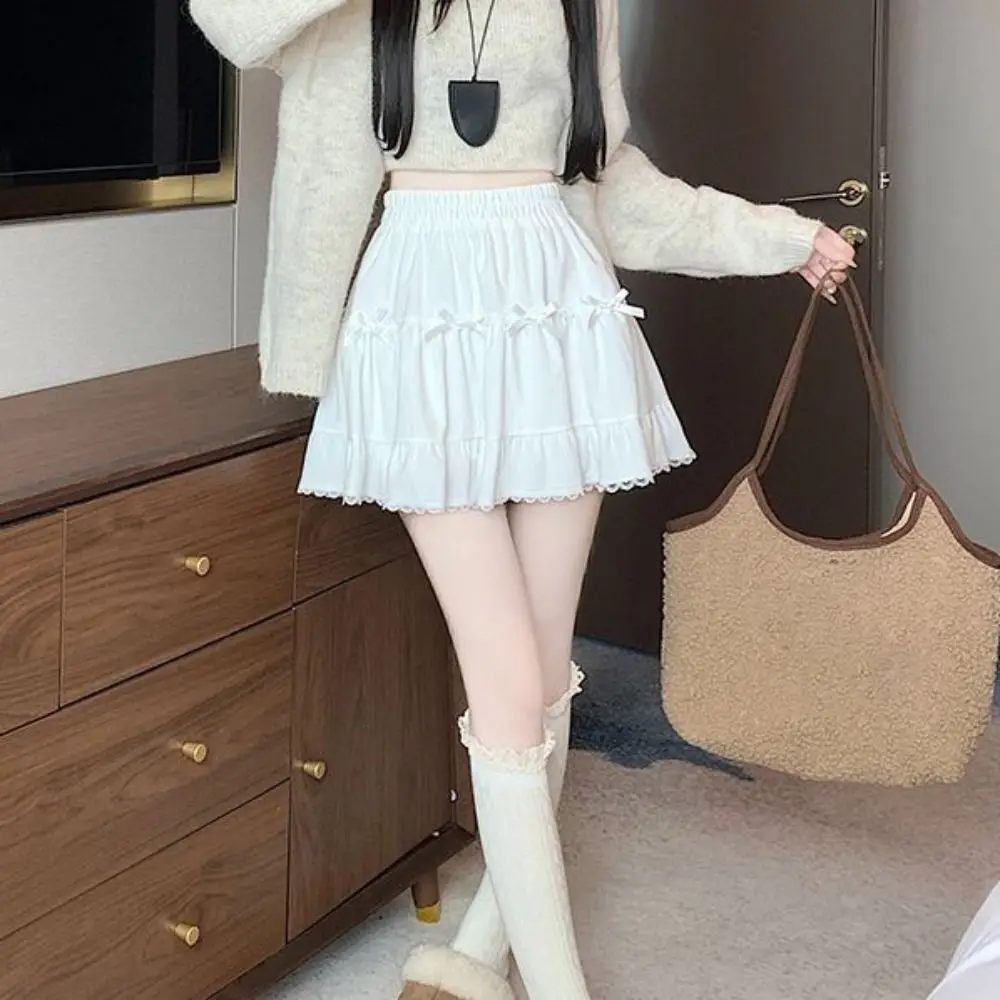 

Короткая мини-юбка для девочек с высокой талией и защитными брюками Свободная юбка трапециевидной формы с бантом Платье-торт с рюшами Кружевные плиссированные мини-юбки Леди