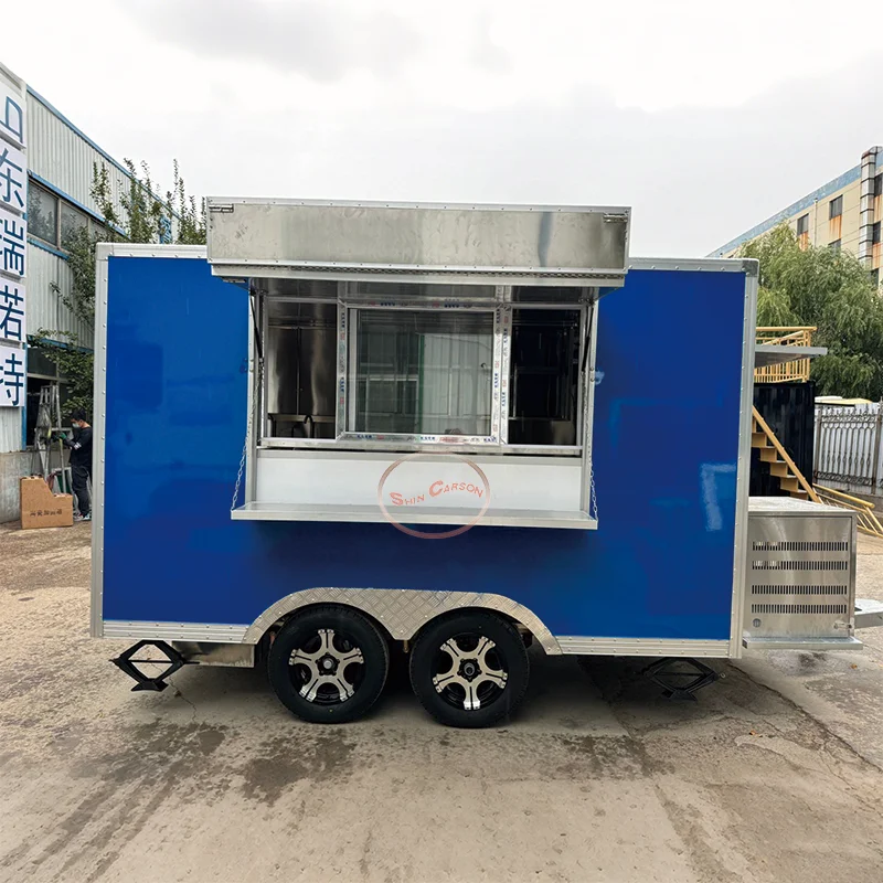 

outdoor food trailer glistens like a moving sapphire under the sun