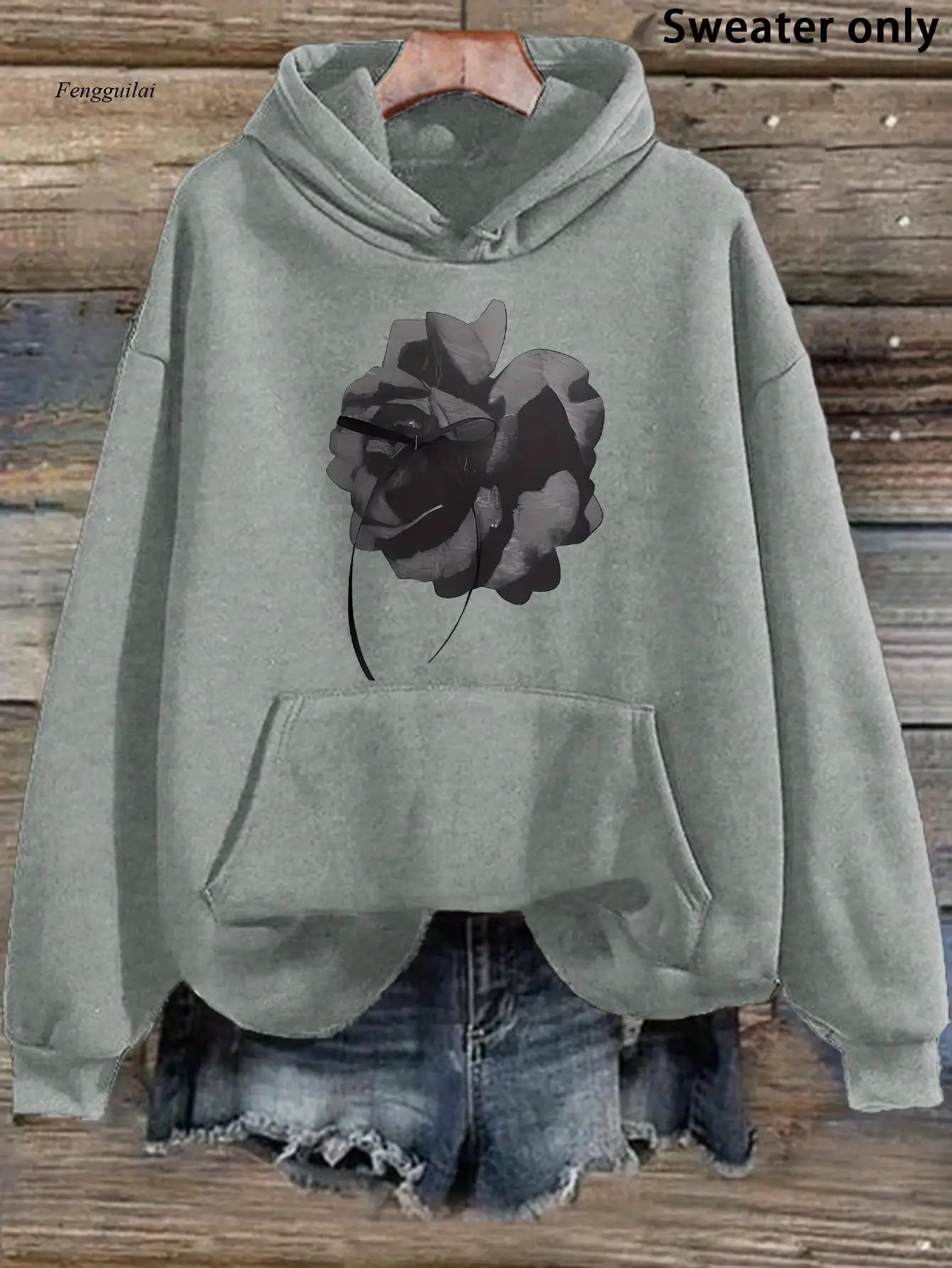 

Повседневная толстовка с капюшоном и стильным черным цветочным принтом, карманом кенгуру и ребристыми манжетами — уютный пуловер с длинными рукавами