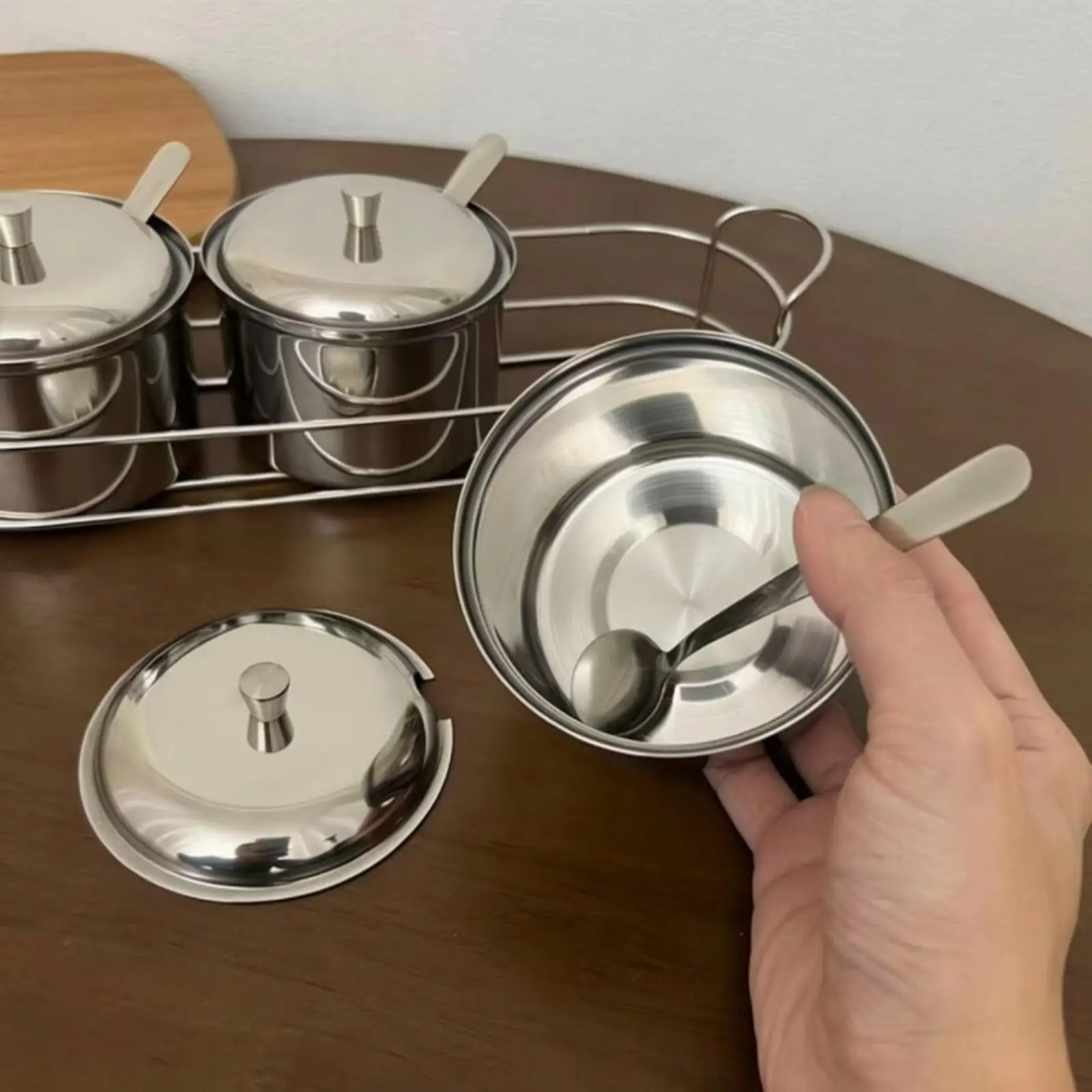 Polished Steel Kitchen Spice Jar with Attached Spoon for Easy Portioning and Clean Counter Organization
