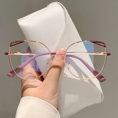 Imagen 1 del producto Montura de gafas de metal hueca de ojo de gato de alta calidad, gafas de protección contra luz azul simples a la moda para mujer, gafas de ordenador, lentes planas