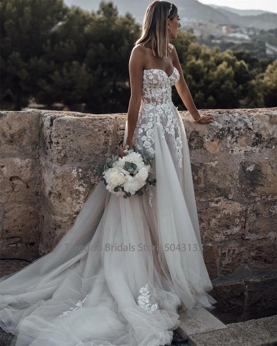 Customized Breathtaking Strapless Wedding Dress Featuring Stunning Crystals Lace Appliques and Flowy Silhouette Bridal Dress