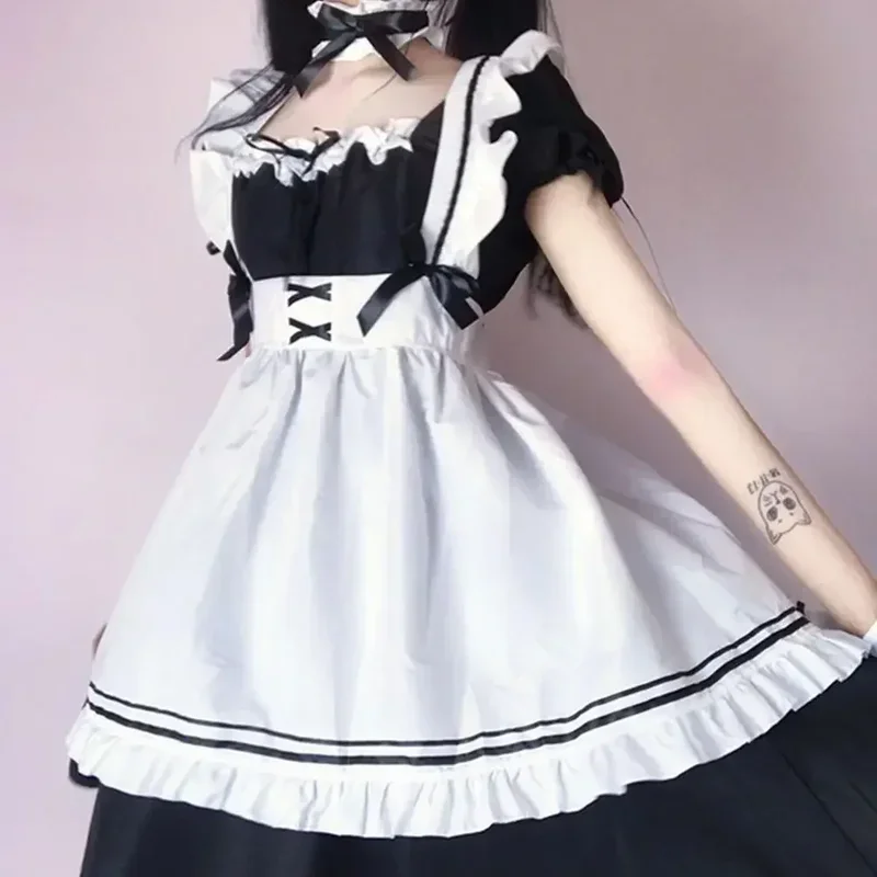 Cosplay ragazza carina Costume nero bianco grembiule vestito Lolita vestito Anime gonna lunga Cafe Costume Cosplay muslimama