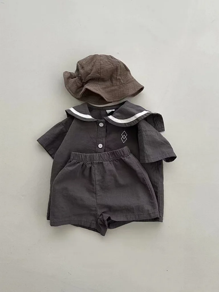 Conjunto de ropa de manga corta para bebé, pantalones cortos informales para niño y niña, traje de cuello azul marino con patrones geométricos,