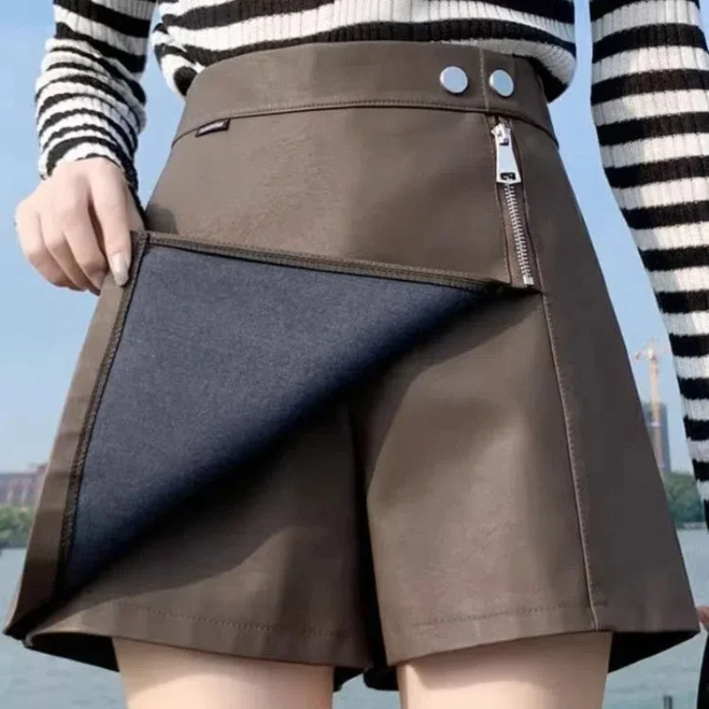 Einfachheit Mode Herbst Neue Frauen Solide Zipper Taste Unregelmäßigen Koreanische Beiläufige Hohe Taille Schlank A-line PU Leder Shorts Röcke