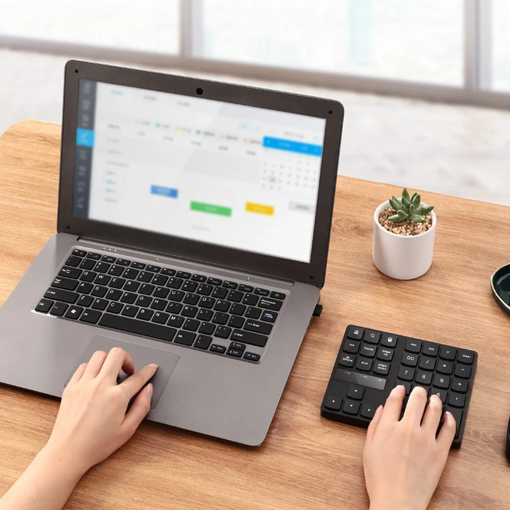 

Optimal 2.4G Wireless Numeric Keypad, Rechargeable Number Pad Keyboard with 35 Keys for PC/Laptop/Macbook/IMac