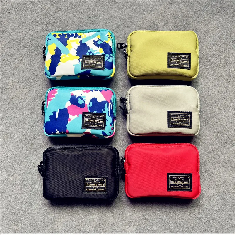 新しいラウンドコーナーミニポータブル小銭入れジッパーキー収納袋かわいいイヤホンキーホルダーバッグトレンディなブランドオックスフォード布若者幾何学模様