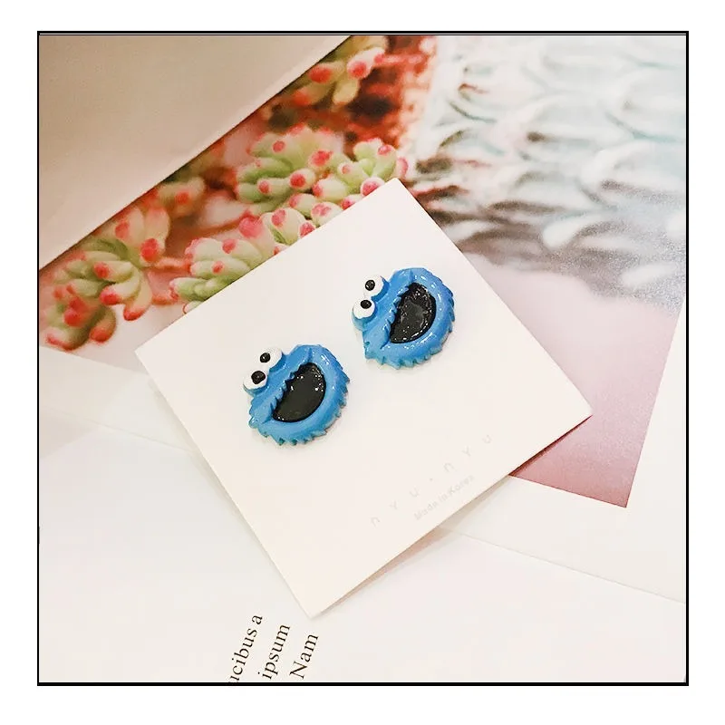 Barrio Sésamo Elmo Cookie Monster anime periférico muñeca de dibujos animados estilo pendientes para niños y niñas accesorios de alto valor regalos