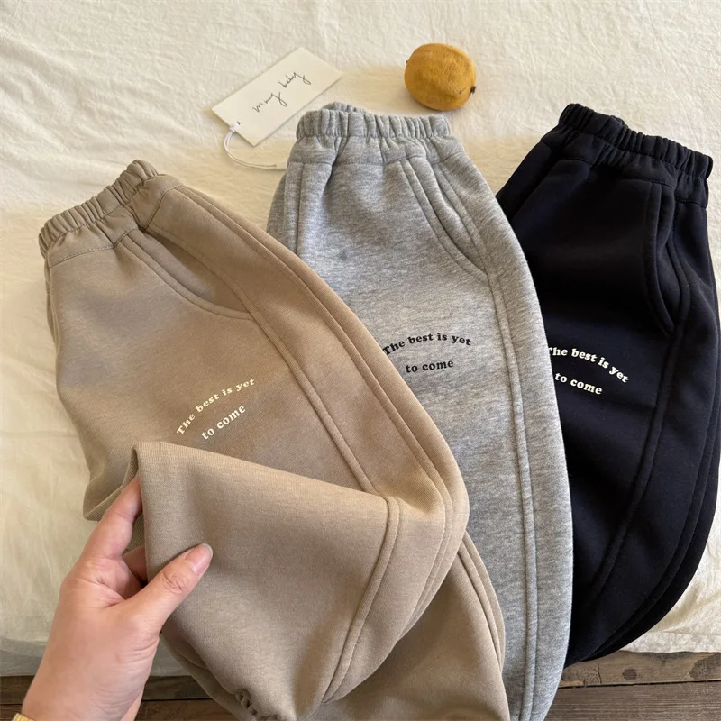 Children's trousers 2025 spring new boys and girls casual letter sweatpants baby simple leggings tide