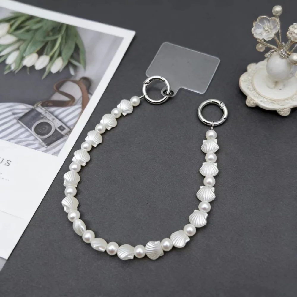 Niche design ins pearl shell phone chain wrist hanging chain anti loss short hanging rope bag CCD hanging decoration