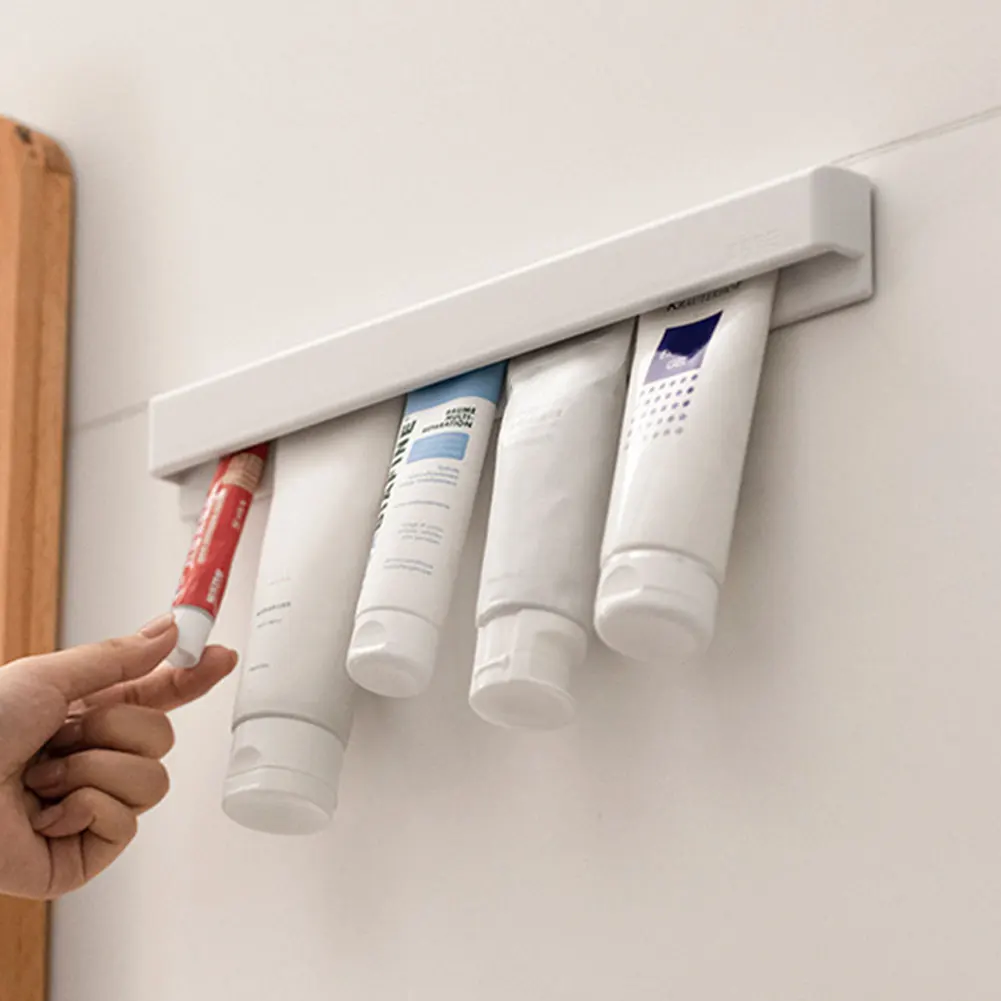 

Wall-Mounted Bathroom Toothpaste Holder No Drill Multifunctional Space-Saving Toothpaste Holder Bathroom Organizer for Bathroom