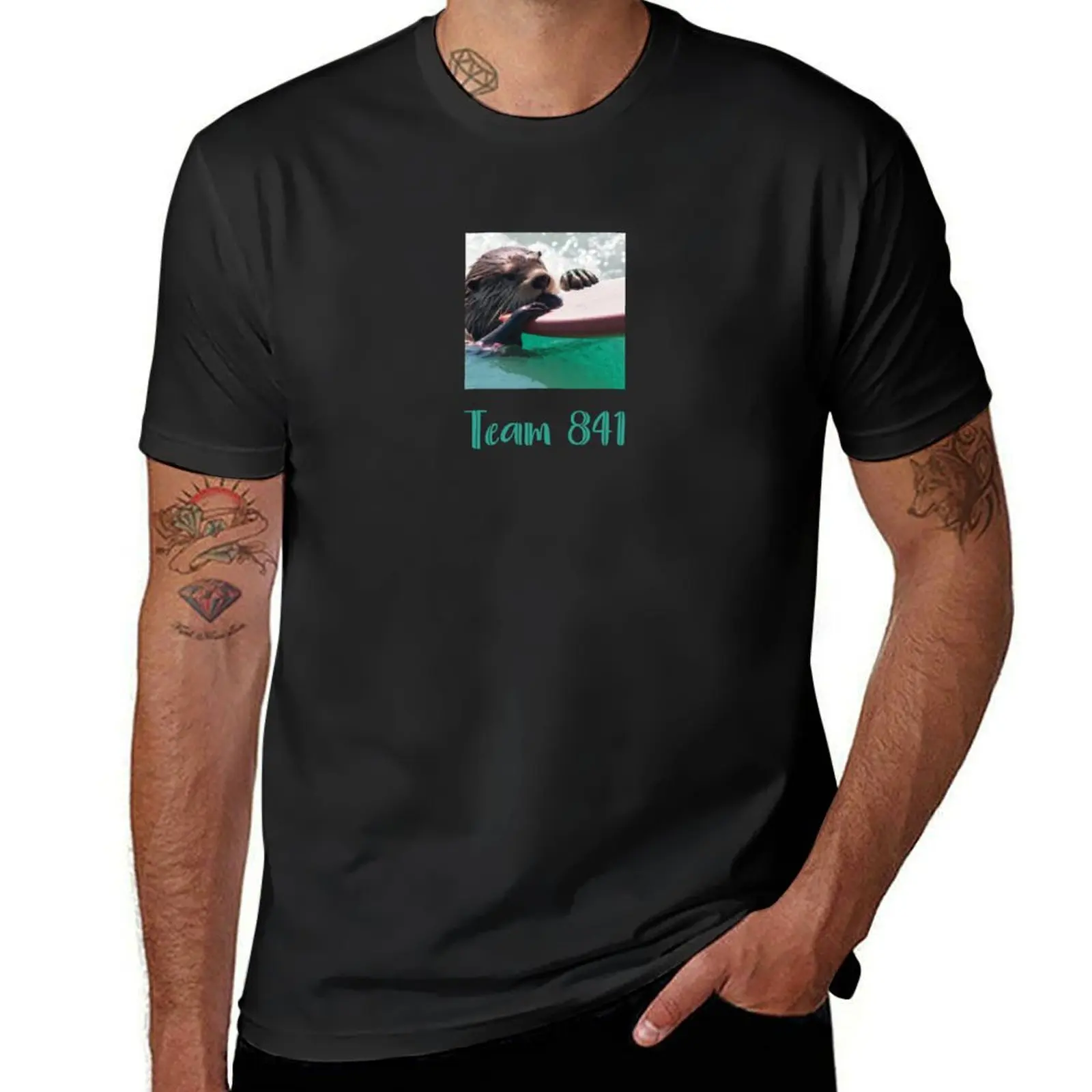 

Surfing otter, team 841, ocean conservation benefit: giving back by donating 100% of the profit to organizations working T-Shirt