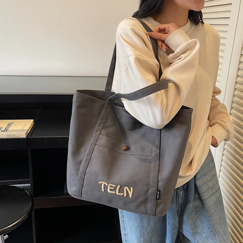 حقيبة كتف ذات سعة كبيرة على الطراز الكوري حقيبة حمل مريحة ومتعددة الاستخدامات حقيبة تخزين نسائية عصرية من القماش للتنقل