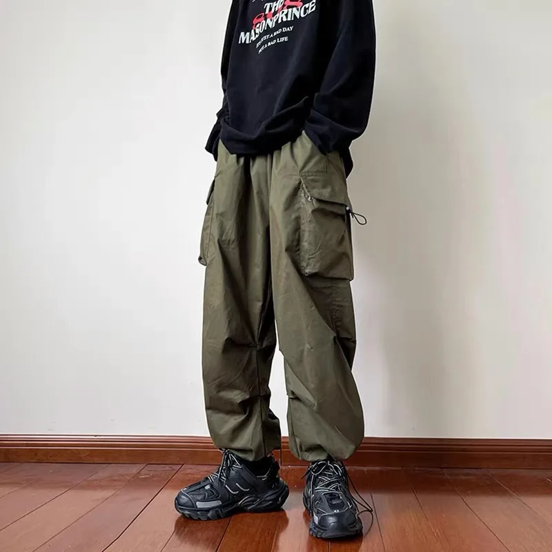 

Streetwear 2023 Spring Harem Casual Pants Men's Elastic Waist Solid Strap Pants Multi Pocket Loose Baggy Pants