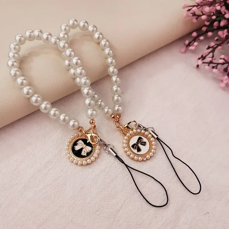 

Женский жемчужный бант, подвеска ручной работы, ремешок на запястье, блестящий зажим, защита от потери, подвеска для телефона