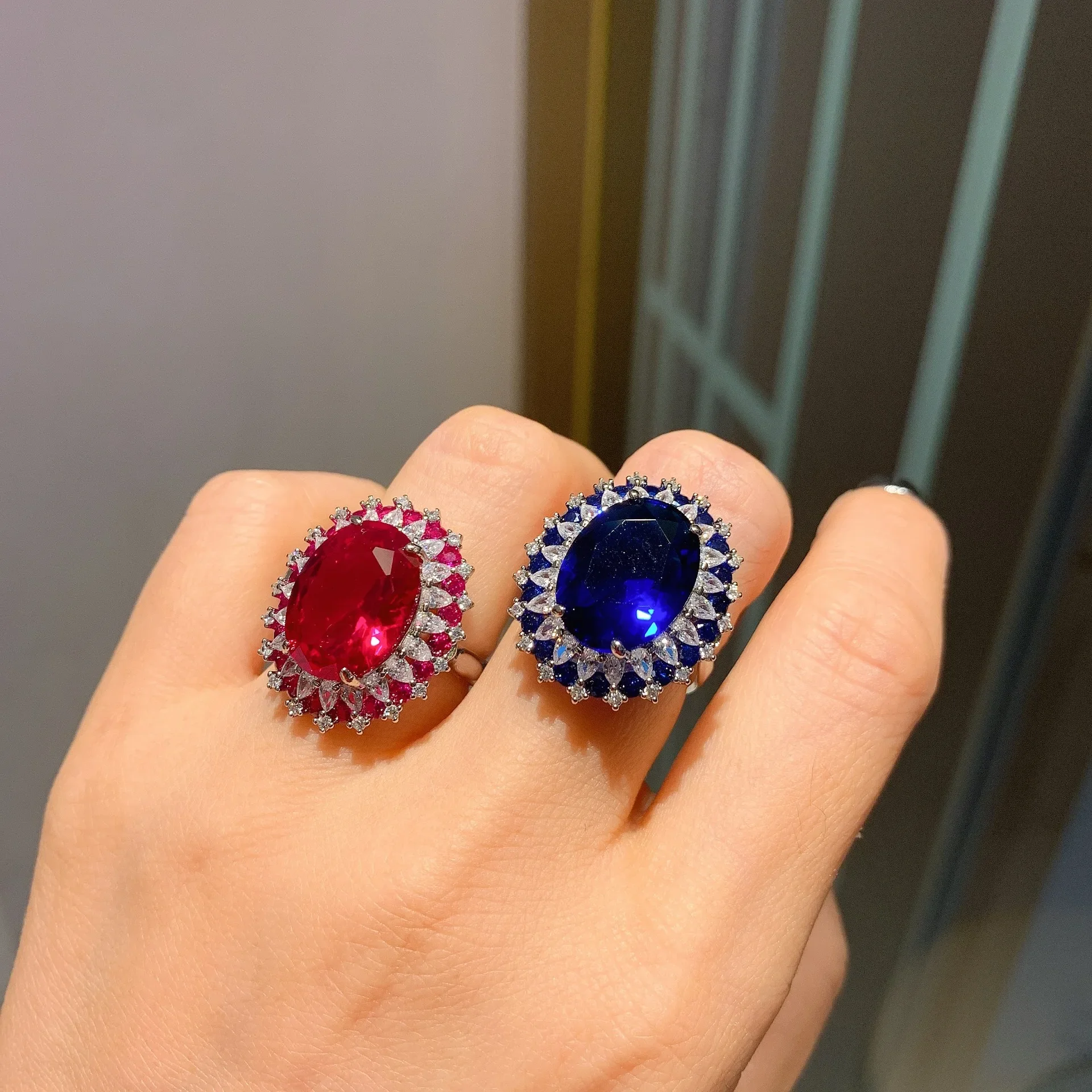 

Adjustable Elegant Oval Gemstone Ring with Sparkling Halo for Women Available in Red and Blue Perfect for Any Occasion Jewelry