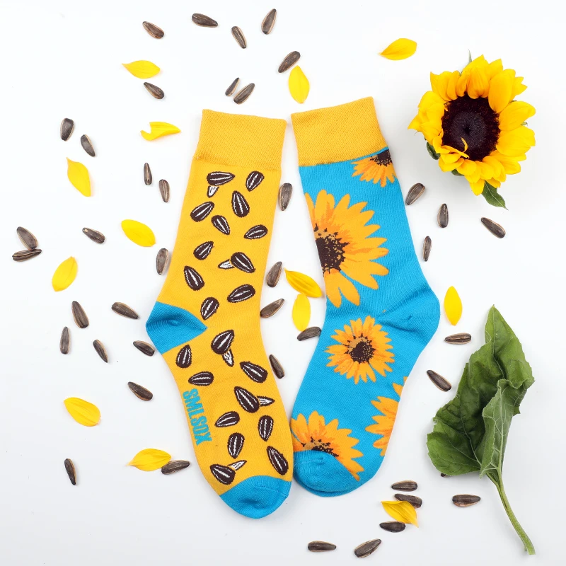 A pair of trendy socks with sunflower and melon seed patterns, asymmetrical AB style socks for men and women, suitable for every