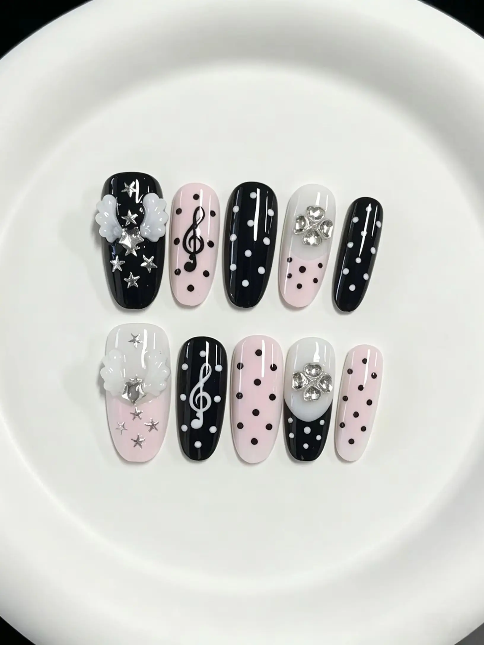 10-Piece Set of Black Polka Dot Angel Wing Long Almond-Shaped Press-On Nails, Featuring Y2K Sweet Girl, Music Girl, Preppy, and Cute Spicy Girl Styles.