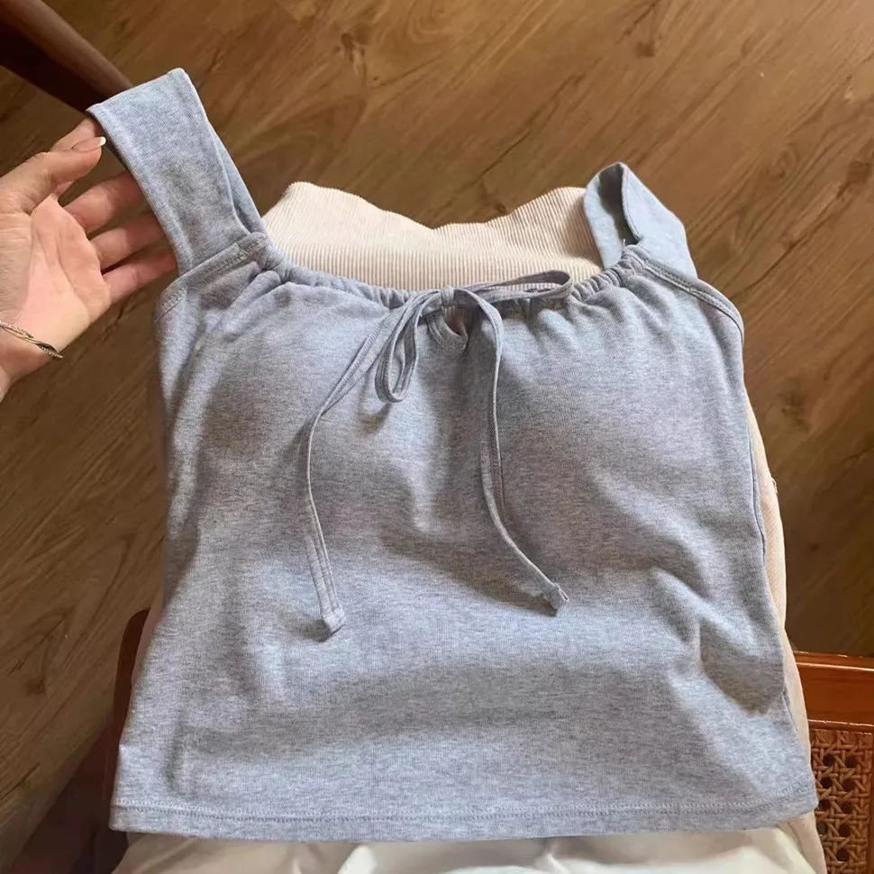 เสื้อกั๊กคอเหลี่ยมแบบใหม่ พร้อมแผ่นรองหน้าอก สายรัดเอว ช่วยให้ดูผอมเพรียว เหมาะสำหรับฤดูร้อน ใส่เที่ยวกลางแจ้ง สายคล้องไหล่กว้างแบบผูกปม แฟชั่นสำหรับผู้หญิง