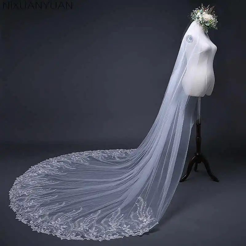 Veli da sposa eleganti Donna Applicazioni monostrato Perline con paillettes Bordo in pizzo Abito da sposa in tulle Velo De Novia Personalizzato