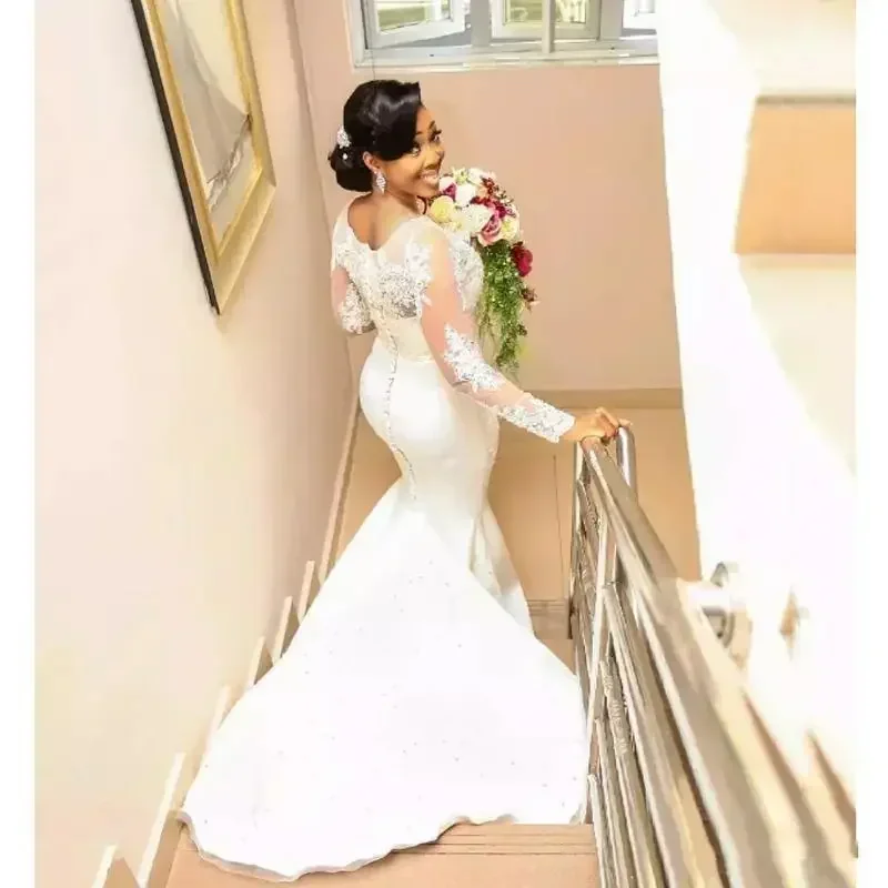 Maßgeschneiderte Vintage-Spitze-Meerjungfrau-Brautkleider, transparente lange Ärmel, Juwelenapplikationen, Perlen, Sweep-Zug, afrikanische Plus-Size-Brautkleider