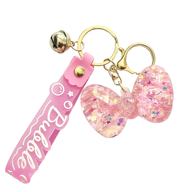 2025 Minso هدايا صغيرة: خرز فقاعي مضيء، سلاسل مفاتيح على شكل فيونكة، معلقات حقيبة، سلاسل مفاتيح السيارة، المعلقات، آلة مخلب، رائعة