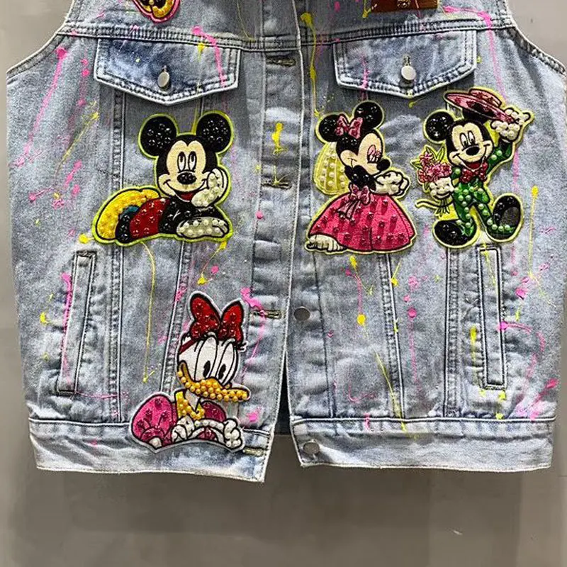 Kamizelka w stylu commuter z koralikami, cekinami i graffiti, kurtka dżinsowa o średniej długości w stylu heavy industry, wiosna-jesień 2026, kamizelka Y2k z motywem kreskówkowym.