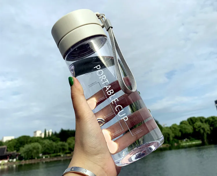

Stylish Shatterproof Sports Water Bottle - Space Cup with Dual Lids & Tea Infuser, Portable with Carry Strap for Gym & Outdoor